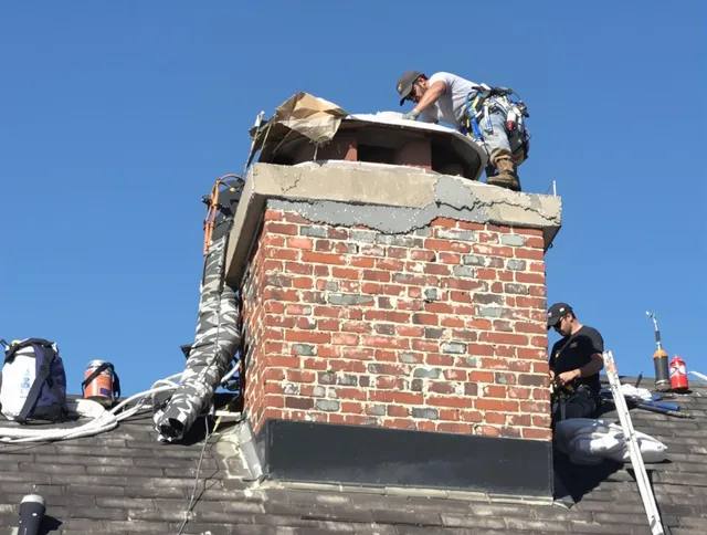 North Port Chimney Sweep installing a custom chimney crown in North Port, FL