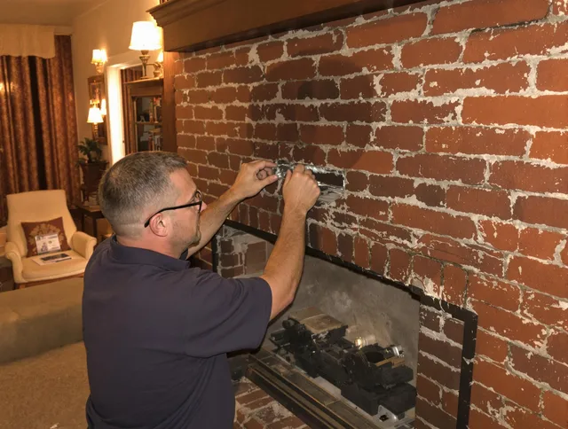 North Port Chimney Sweep expert fixing a fireplace in North Port, FL